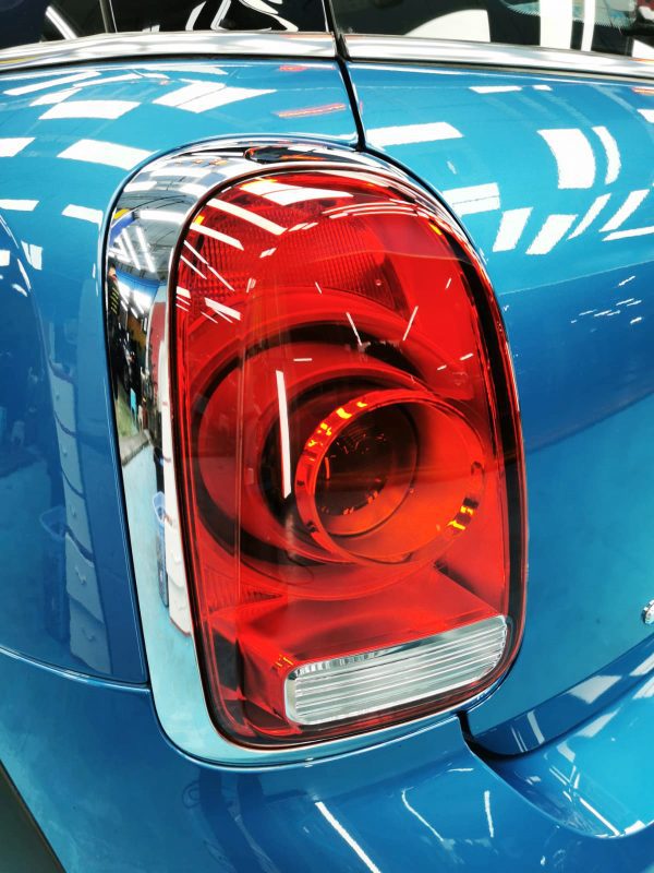 The coated bonnet of the Countryman under workshop lighting.