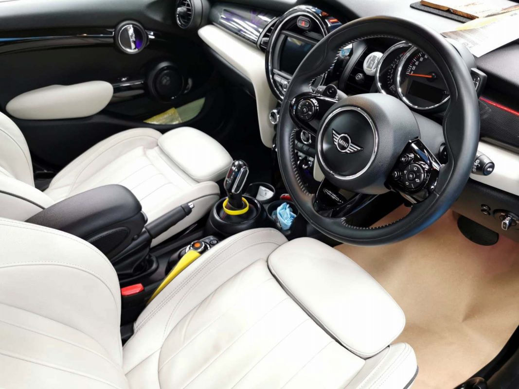 The MINI Cooper parked in the workshop, freshly coated.