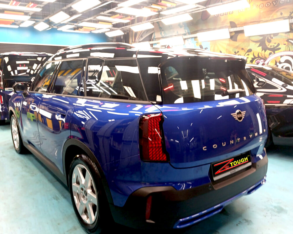 Rear quarter of the Countryman Cooper, glossy and protected.