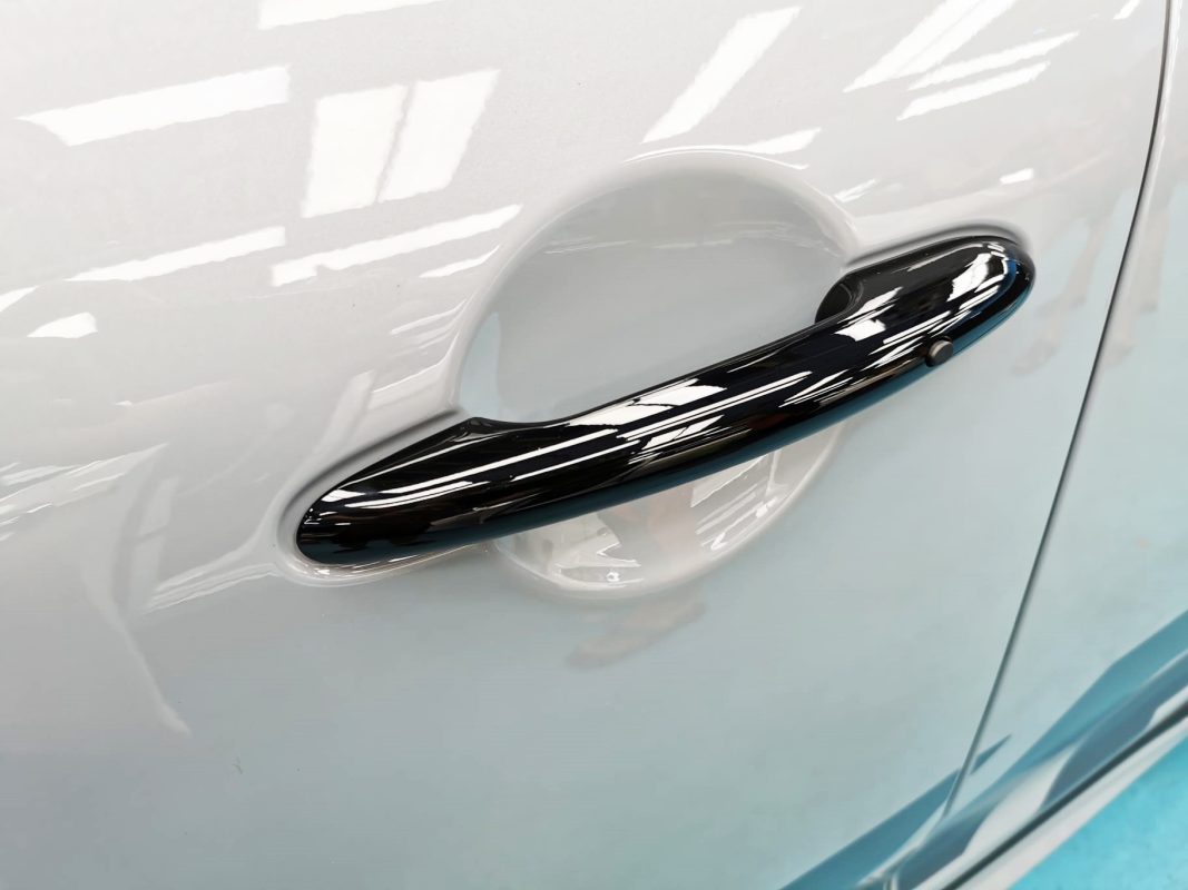 Rear quarter of the MINI Countryman, glossy and protected.
