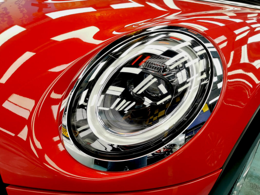 The MINI One's coated paintwork showing clean reflections.