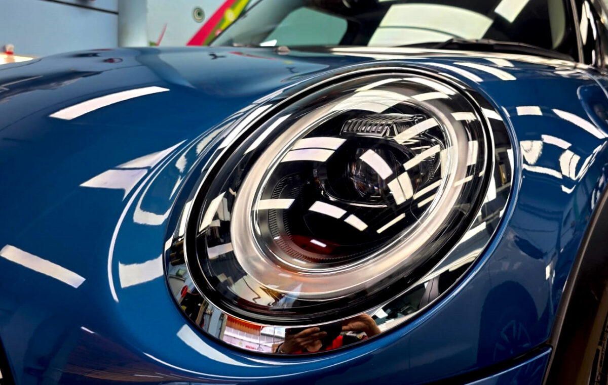 The MINI One's coated paintwork showing clean reflections.