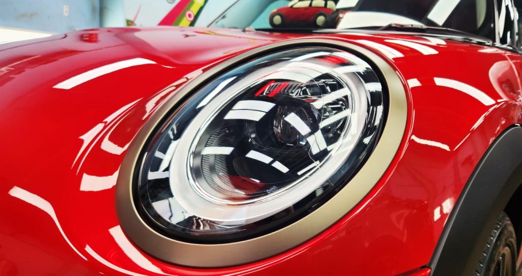 The MINI One's coated paintwork showing clean reflections.