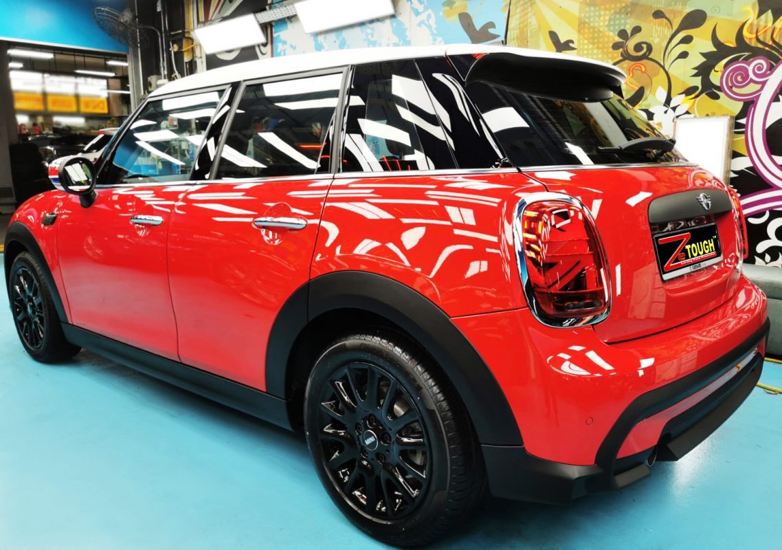 Rear quarter of the MINI One SW, glossy and protected.