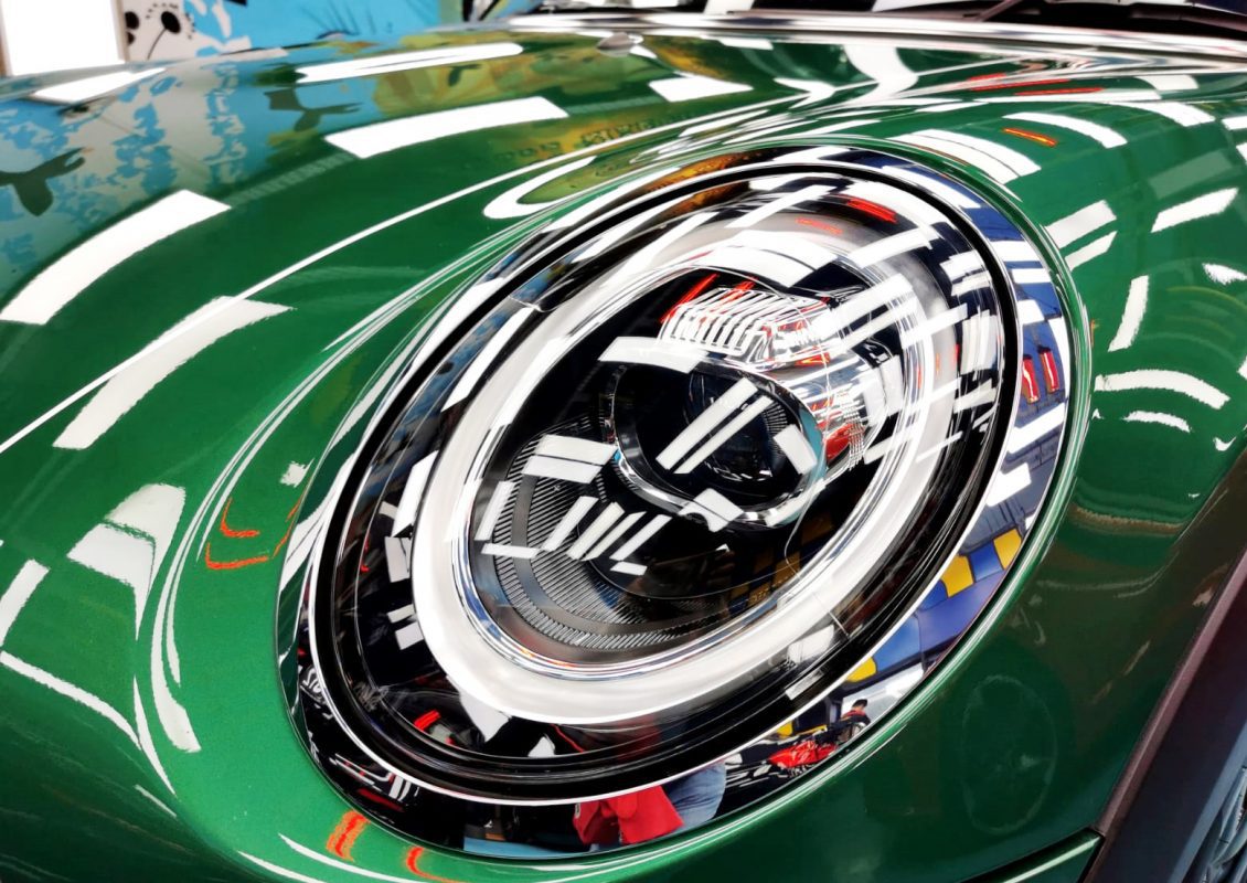 The MINI One's coated paintwork showing clean reflections.
