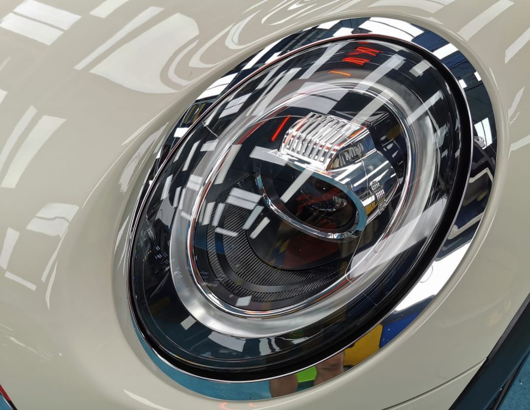 The MINI One's coated paintwork showing clean reflections.