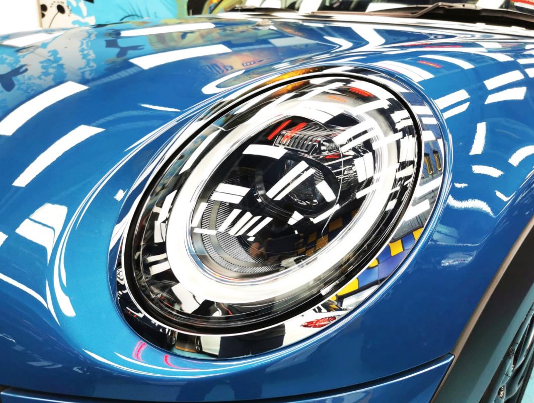 The MINI One's coated paintwork showing clean reflections.