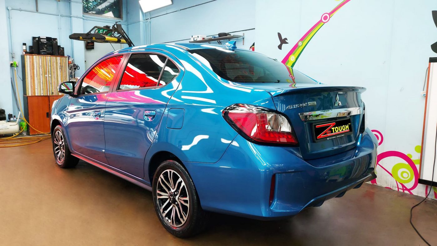 Rear quarter of the Mitsubishi Attrage, glossy and protected.