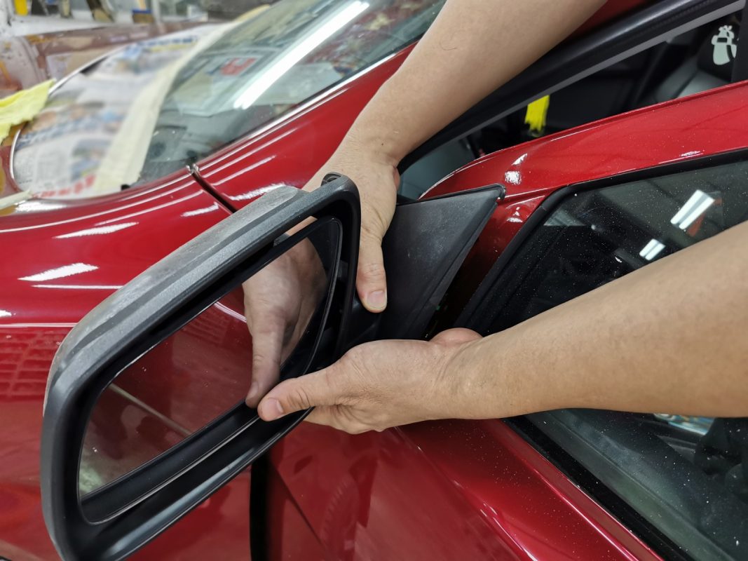 Polishing the new paint on the Lancer to bring up the shine.