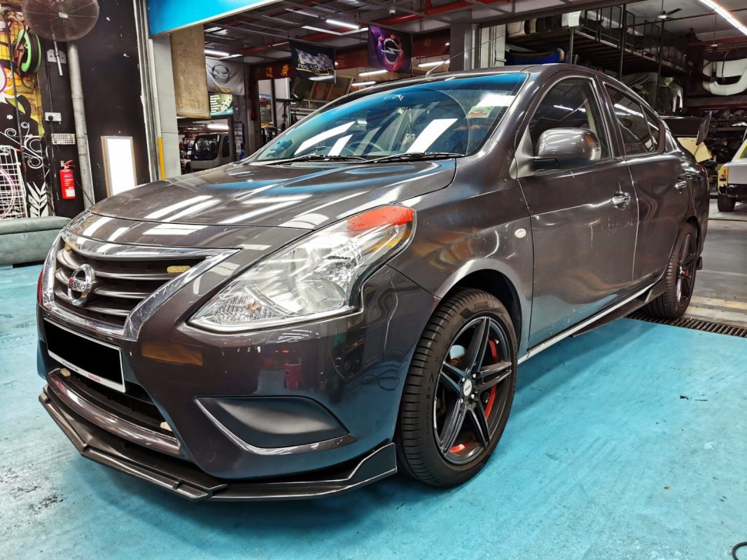 The Nissan Almera as it arrived at Revol Carz, front three-quarter view before the respray.