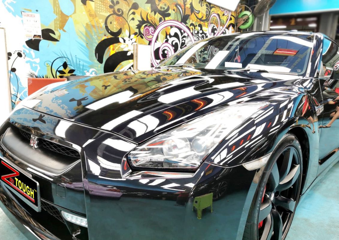 The Nissan GT-R from a side angle after the ceramic coating.