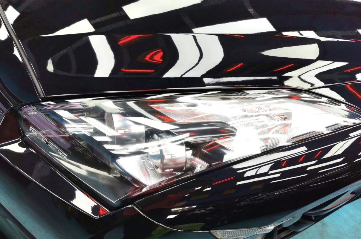 The GT-R's coated paintwork showing clean reflections.