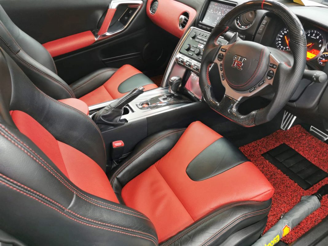 The Nissan GT-R parked in the workshop, freshly coated.