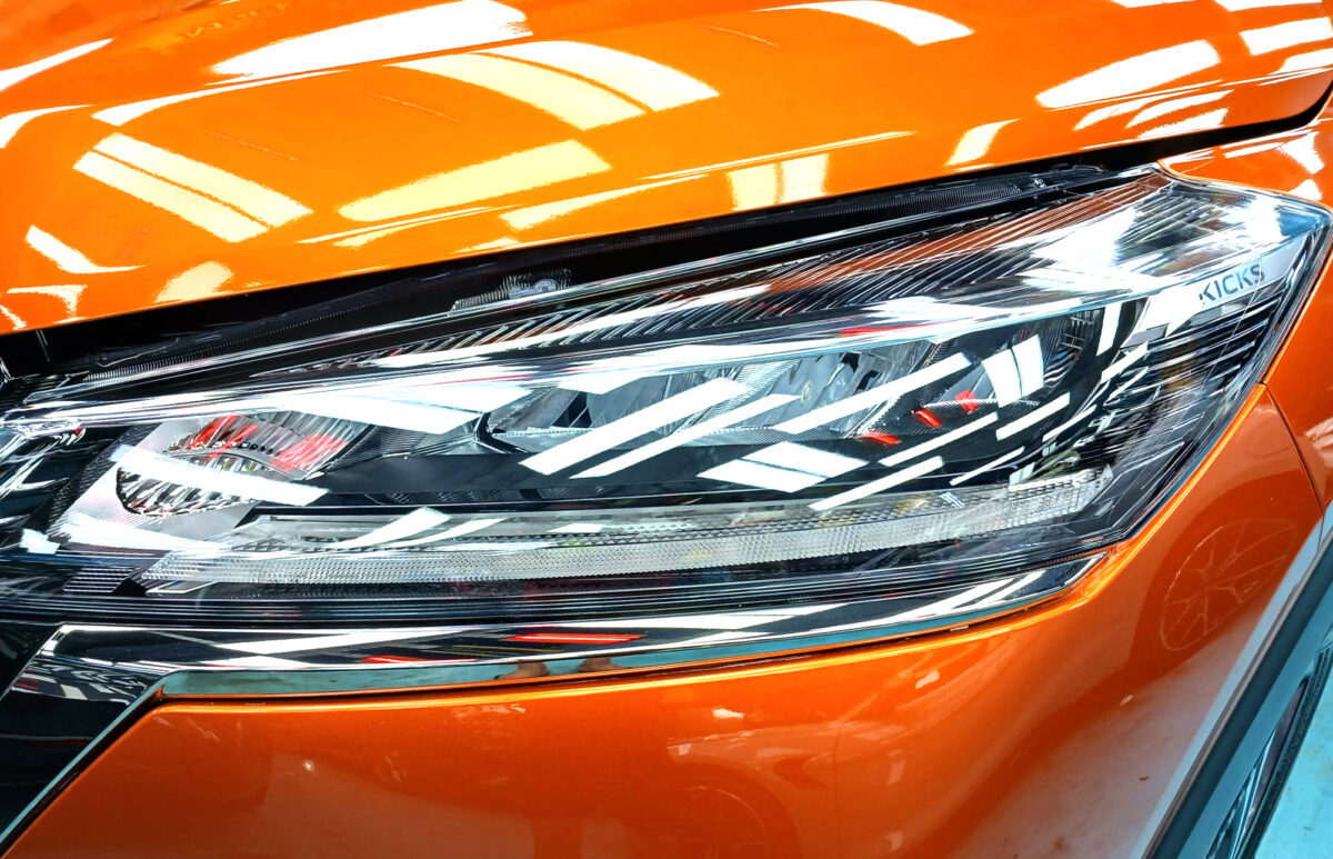 The Nissan Kicks' coated paintwork showing clean reflections.