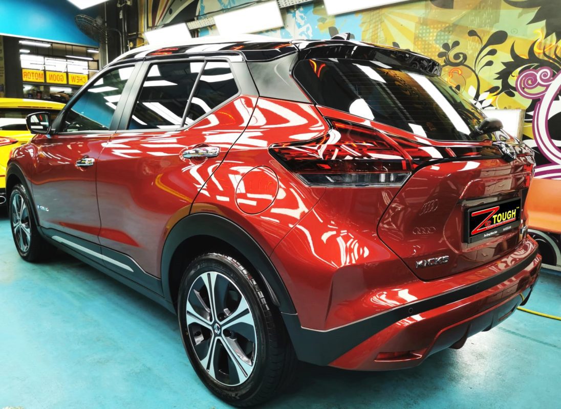 Rear quarter of the Kicks, glossy and protected.