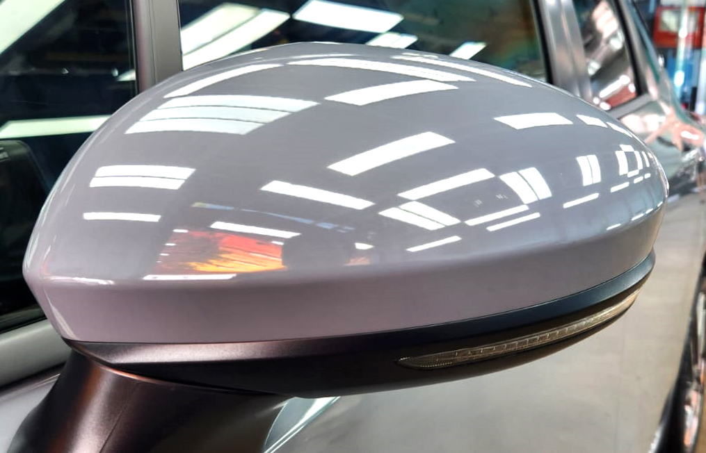 Rear quarter of the Nissan Note, glossy and protected.