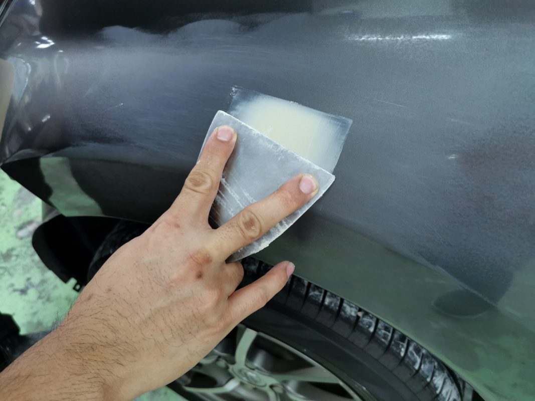 The Note's body being scanned and patched for scratches and dents.