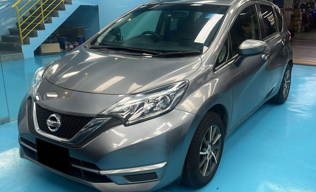 The Nissan Note as it arrived at Revol Carz, front three-quarter view before the respray.