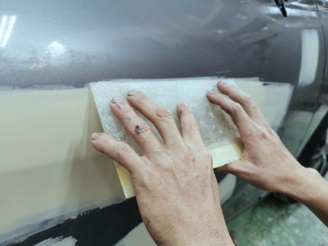 The surface of the Nissan Note inspected for scratches and dents before bodywork.