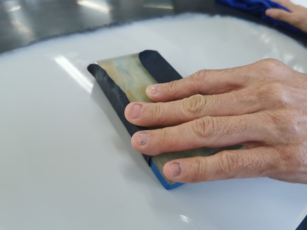 Wet-sanding continued on another panel of the Nissan Note.