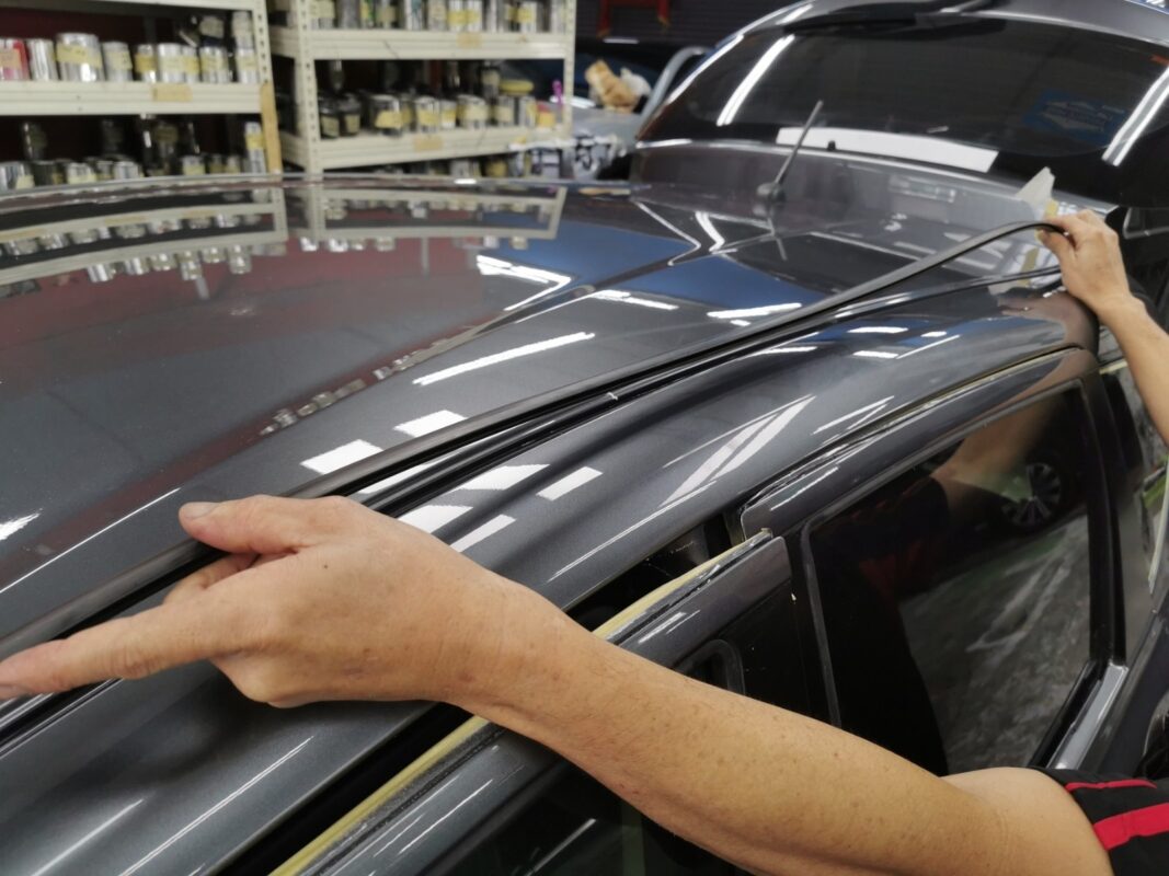 Polishing and reassembly work on the Nissan Note after the paint has been laid.
