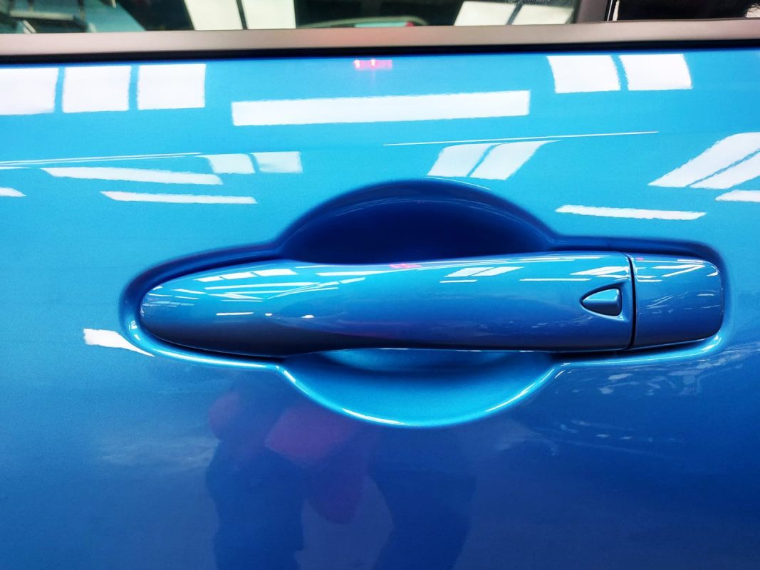 Rear three-quarter view of the Nissan Note, glossy and protected.