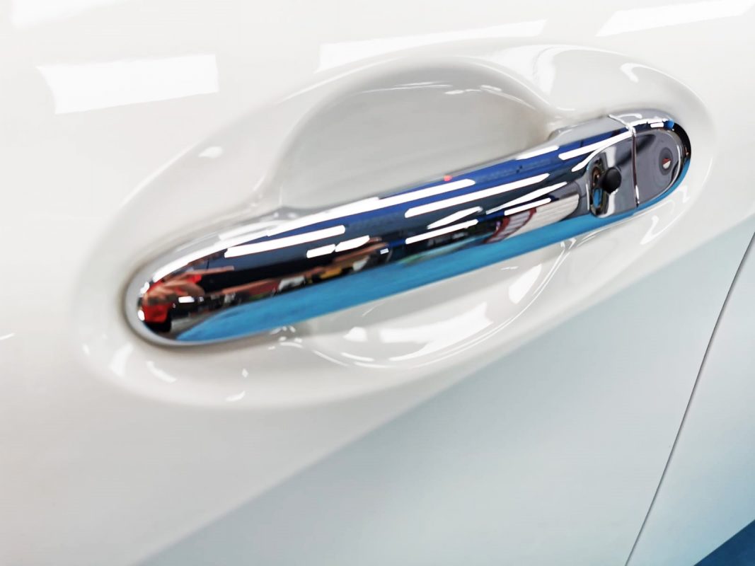 Rear three-quarter view of the Nissan Note, glossy and protected.