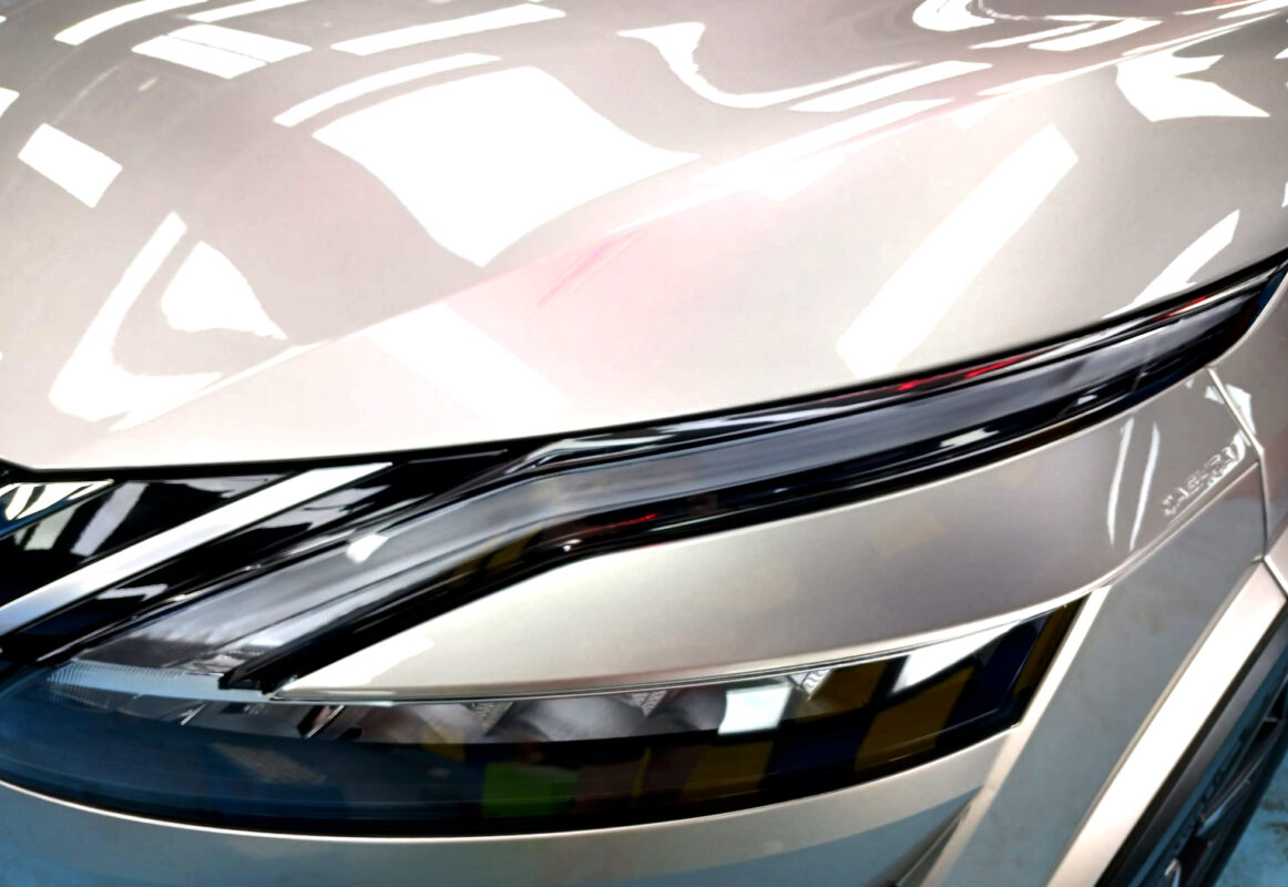 The Qashqai's coated paintwork showing clean reflections.