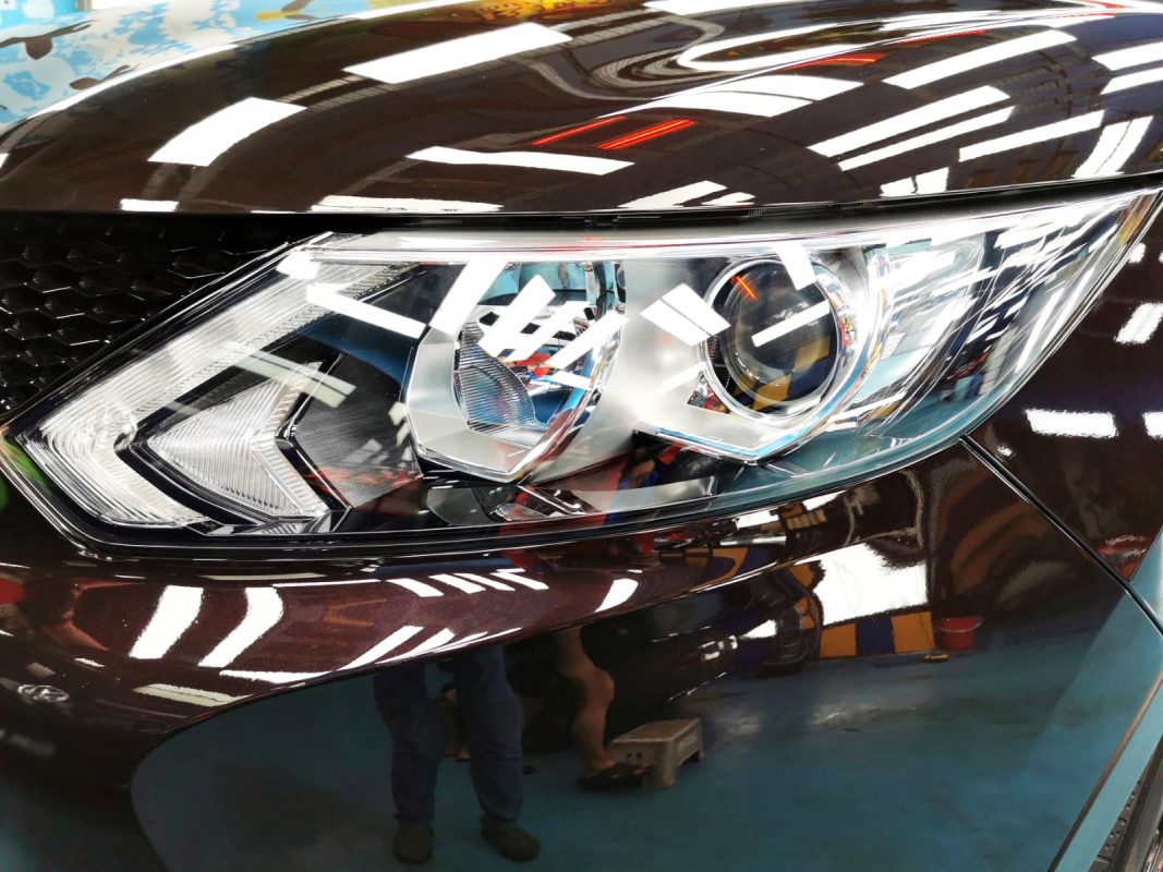 The Qashqai's coated paintwork showing clean reflections.
