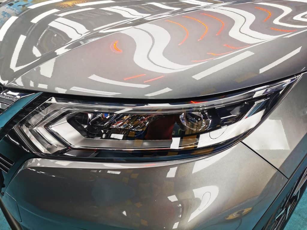 The Qashqai's coated paintwork showing clean reflections.