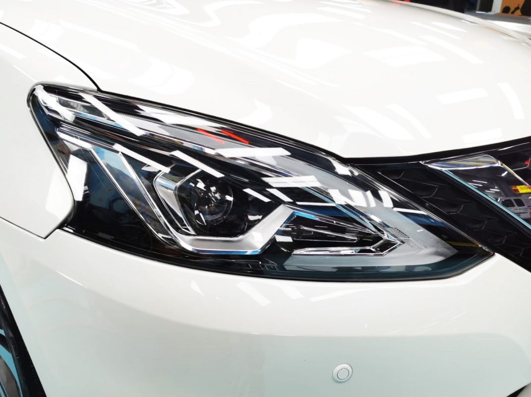 The Sylphy's coated paintwork showing clean reflections.