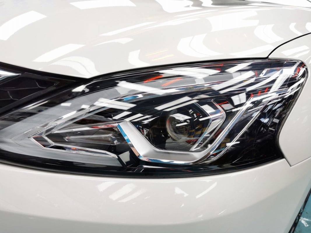 The Sylphy's coated paintwork showing clean reflections.
