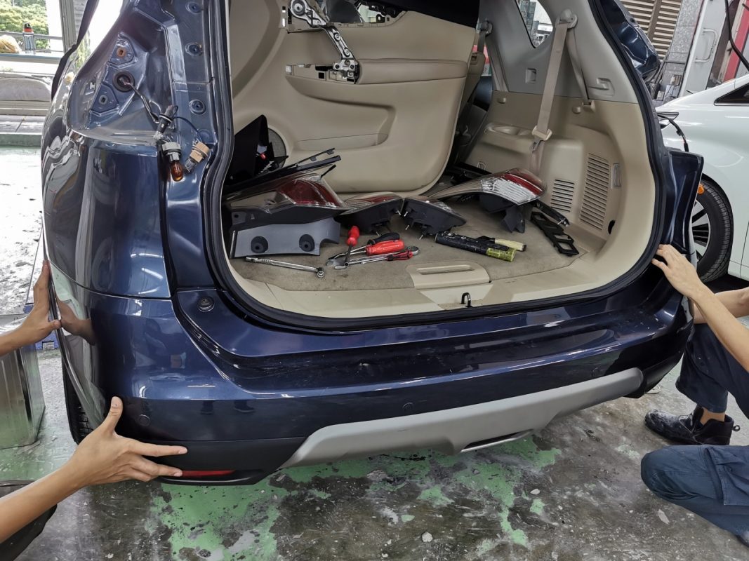 Parts being dismantled from the Nissan X-Trail before prep work.