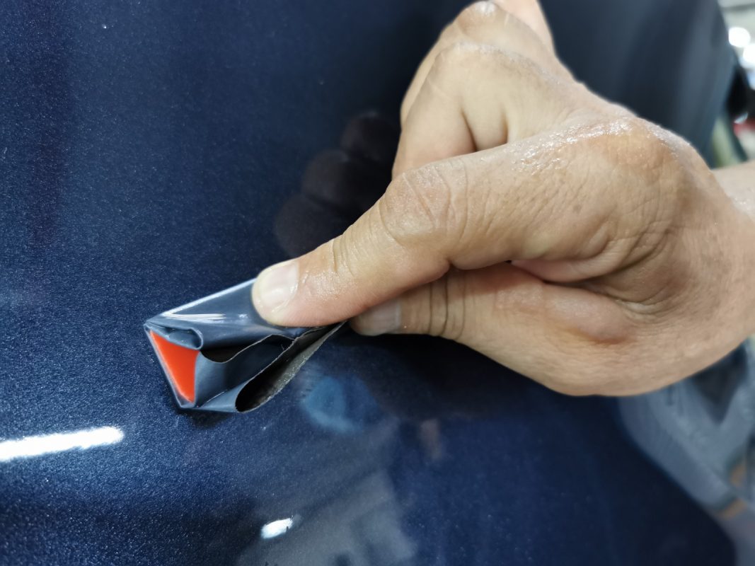 The X-Trail after spraying, being wet-sanded again for an even surface.