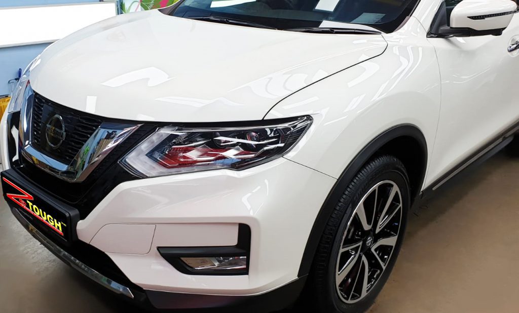The Nissan X-Trail from a side angle after the titanium coating.