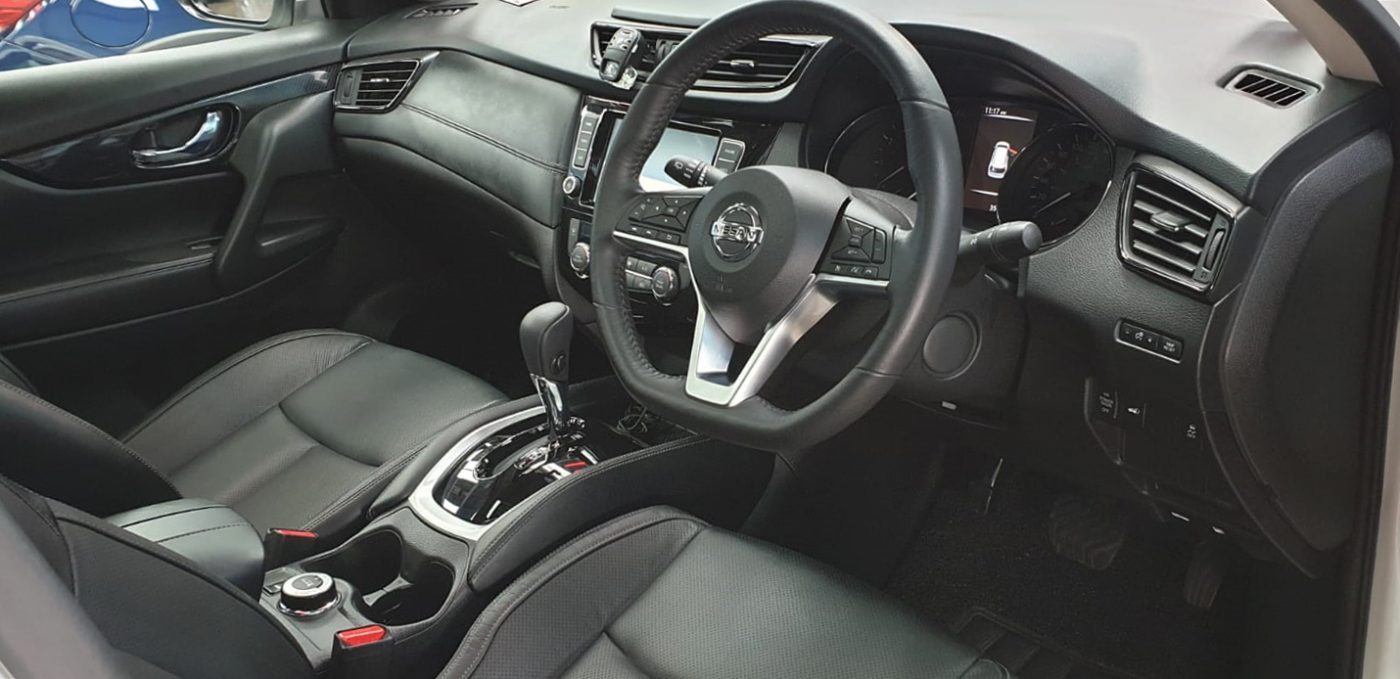 Front three-quarter view of the coated Nissan X-Trail.