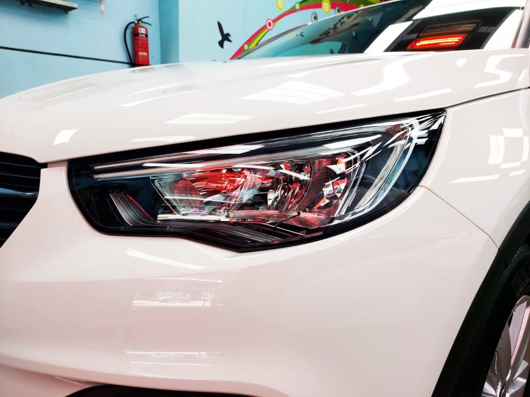 The Grandland X's coated paintwork showing clean reflections.