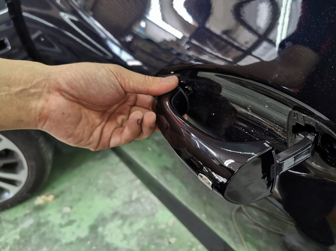 Buffing the new paint on the Insignia to bring up the shine.