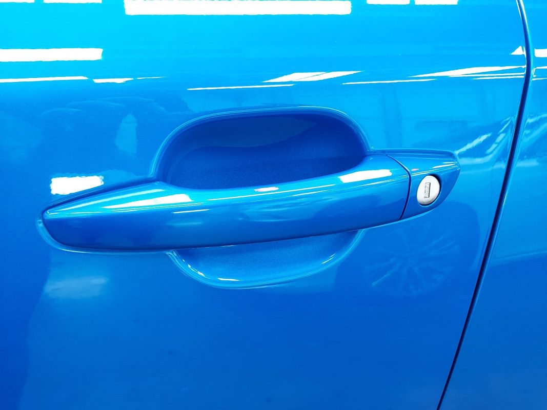 Rear three-quarter view of the Peugeot 2008, glossy and protected.