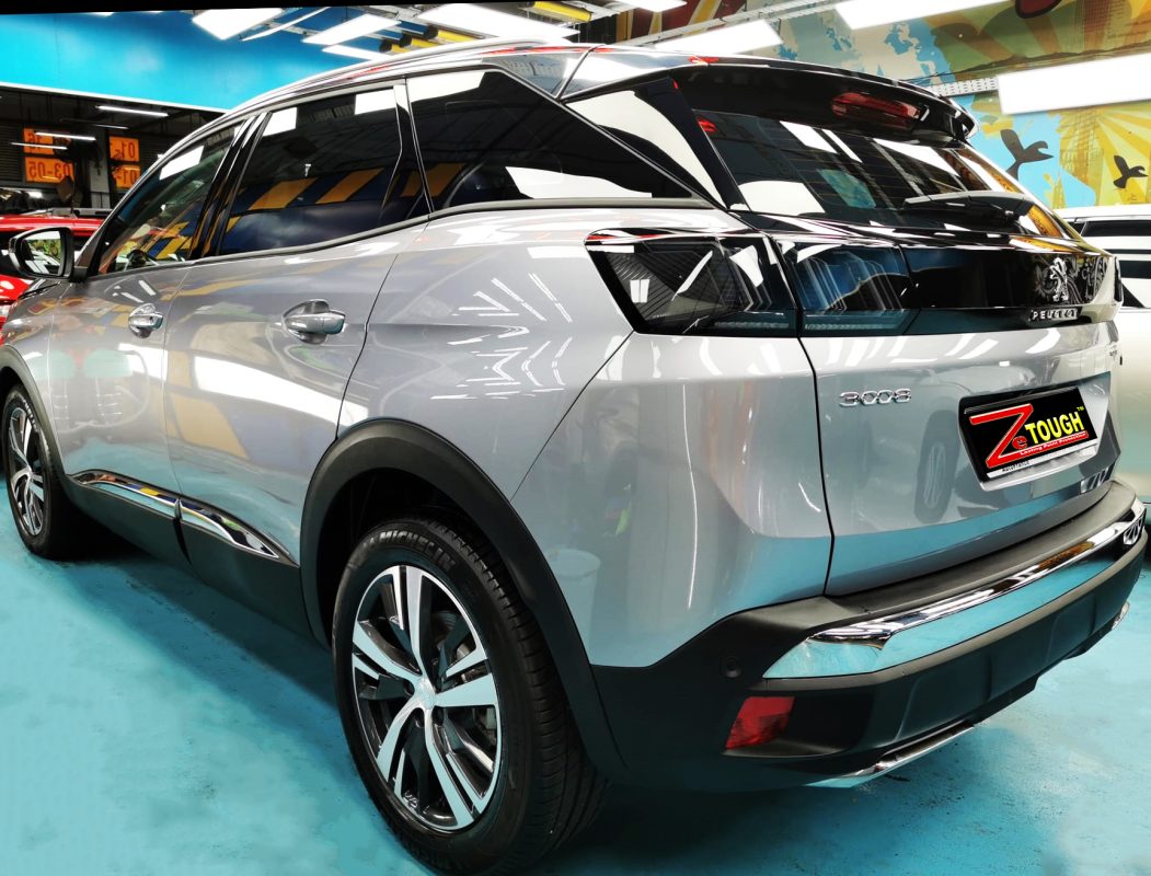 Rear quarter of the Peugeot 3008, glossy and protected.