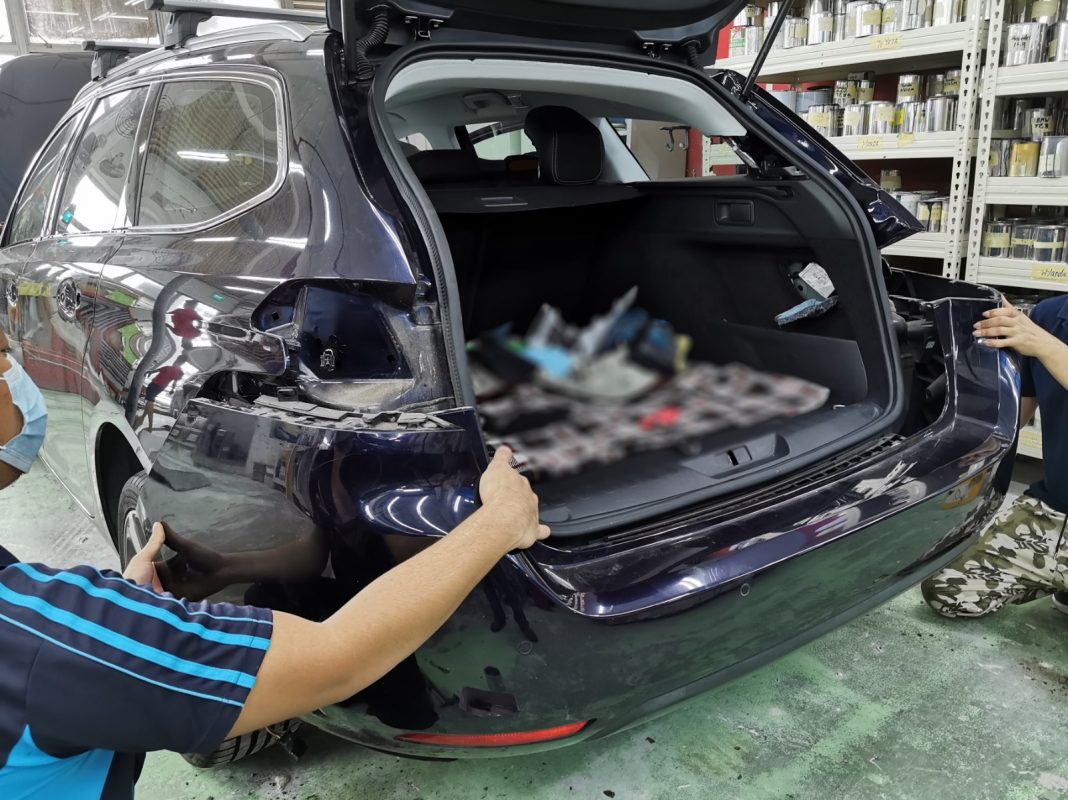 The 308 with car parts removed in preparation for spraying.
