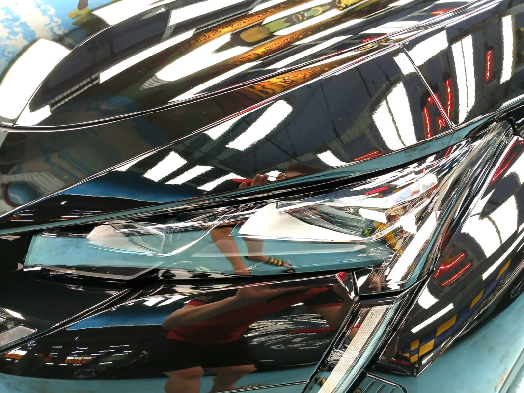The 408's coated paintwork holding clean reflections.