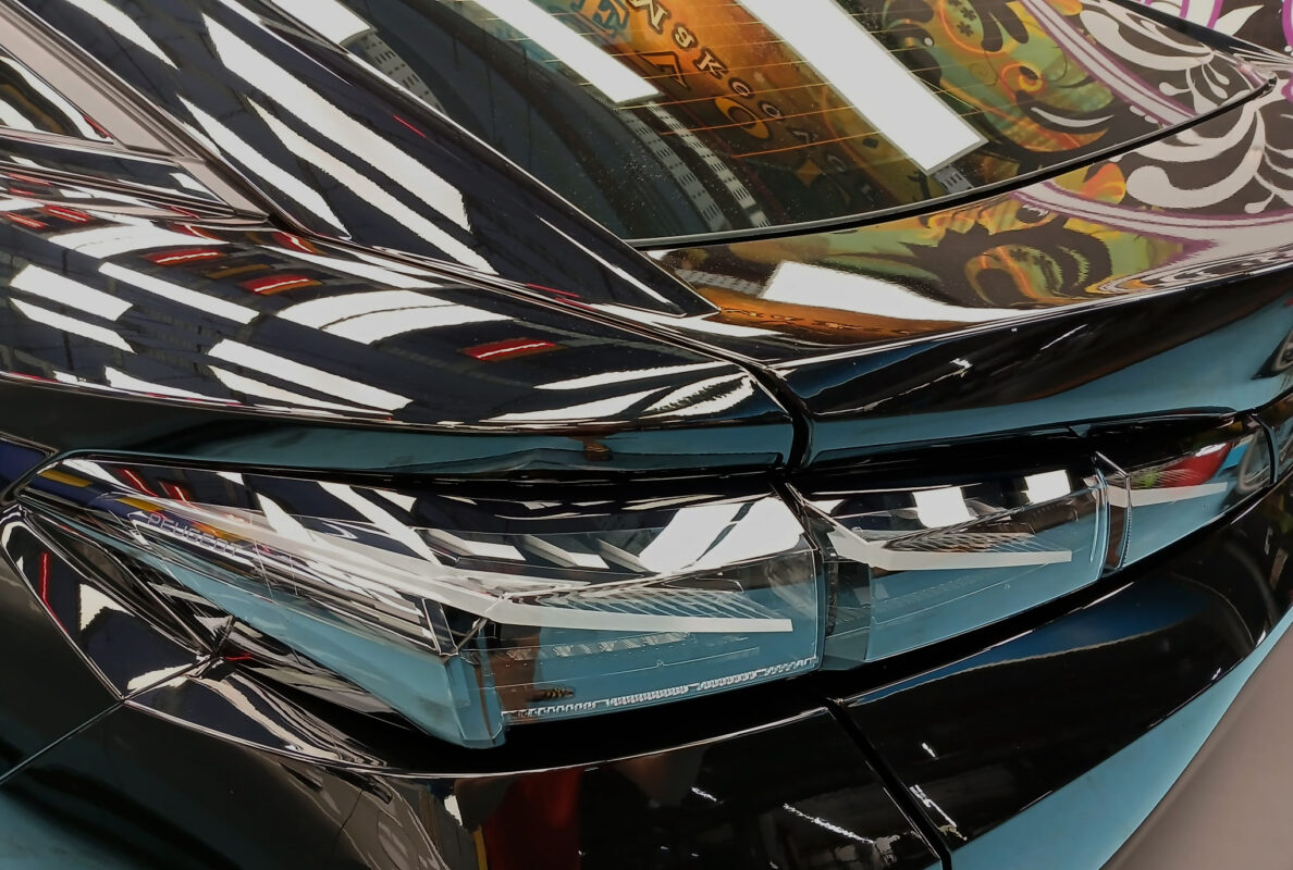 Close-up of the 408's coated surface under workshop lighting.