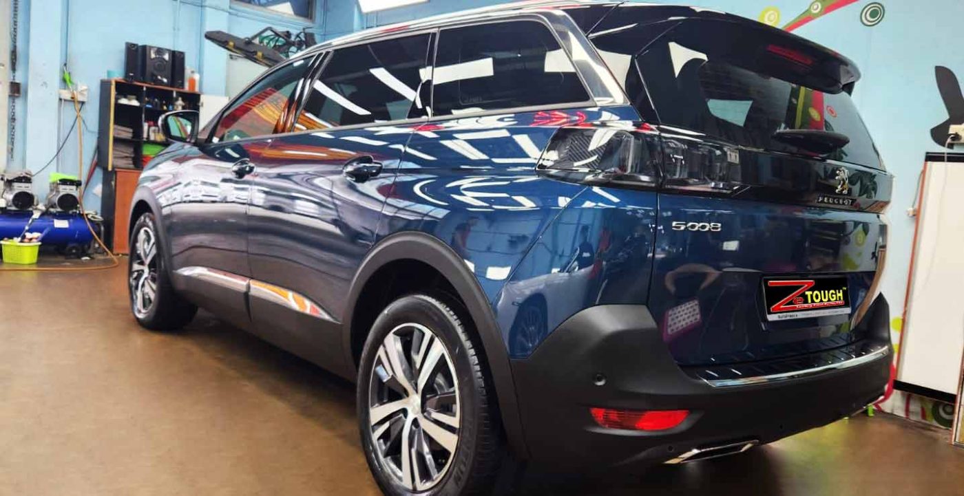Rear quarter of the Peugeot 5008, glossy and protected.