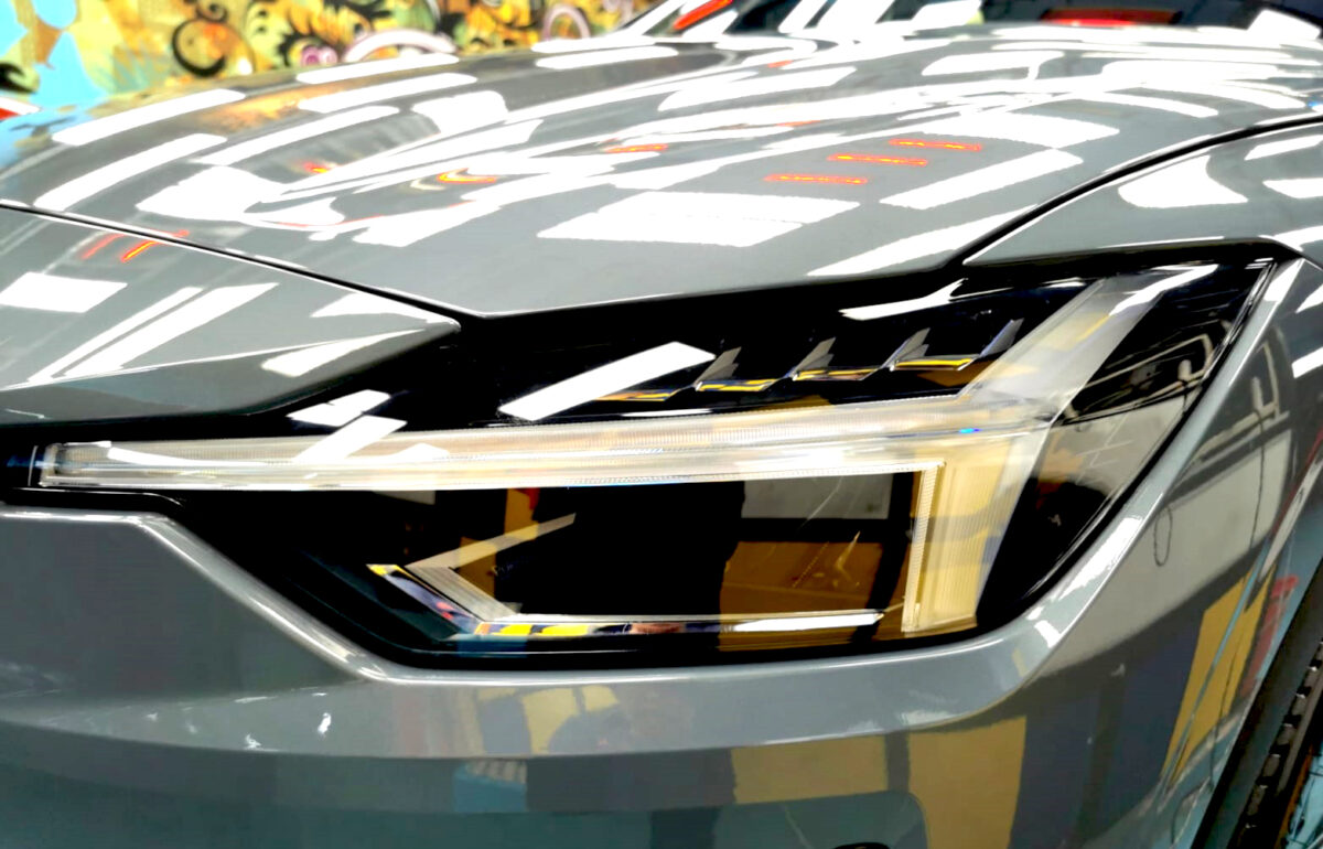 The Polestar 2's coated paintwork holding clean reflections.