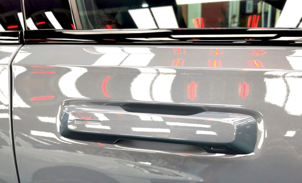 Rear quarter of the Polestar 2, glossy and protected.