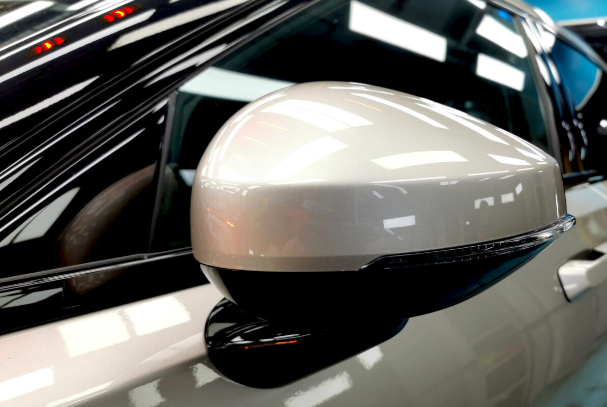 Rear quarter of the Polestar 2, glossy and protected.