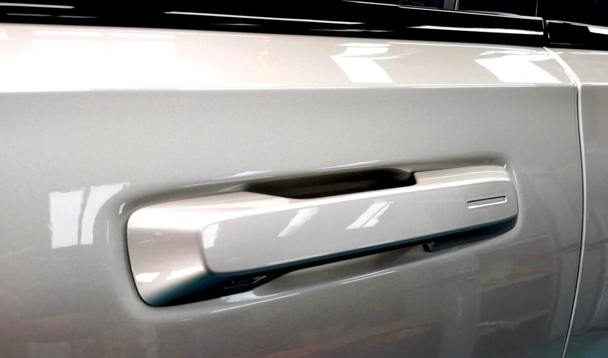 Side panel of the Polestar 2 with the titanium finish locked in.