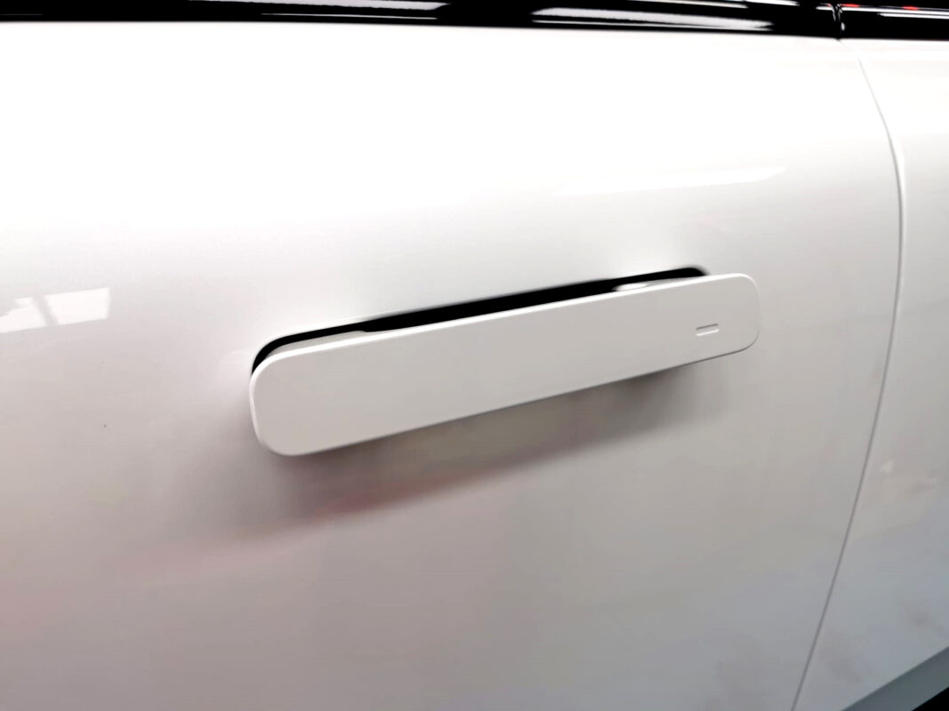 Front three-quarter view of the Polestar 4 after coating.