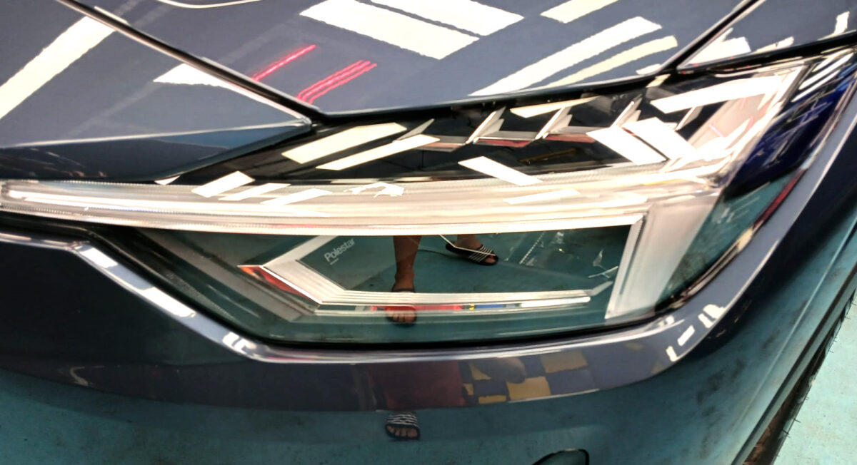 The Polestar's coated paintwork holding clean reflections.